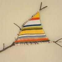 ejemplo de tapiz sobre ramas naturales 